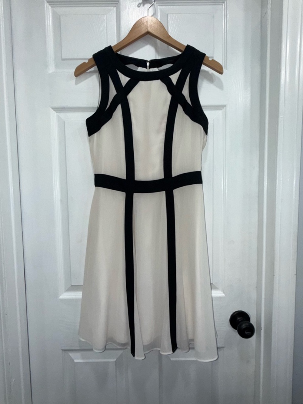 Sleeveless White Dress with Black Trim